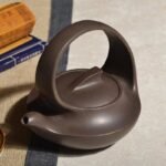 宜兴紫砂壶 | 曲壶提梁_泥料：紫泥_容量：260cc