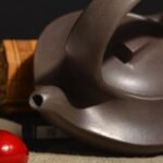 宜兴紫砂壶 | 曲壶提梁_泥料：紫泥_容量：260cc