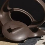 宜兴紫砂壶 | 曲壶提梁_泥料：紫泥_容量：260cc