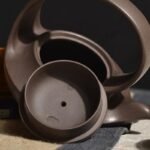 宜兴紫砂壶 | 曲壶提梁_泥料：紫泥_容量：260cc